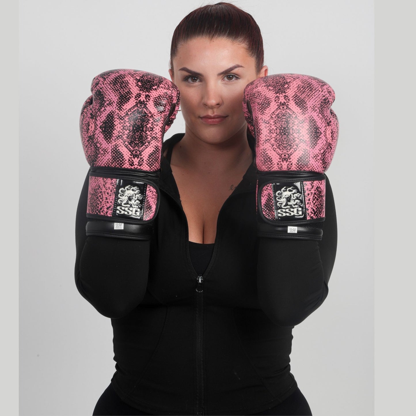 Model wearing Stone’s Kiss boxing gloves in training stance – StoneStrikeGear lifestyle image