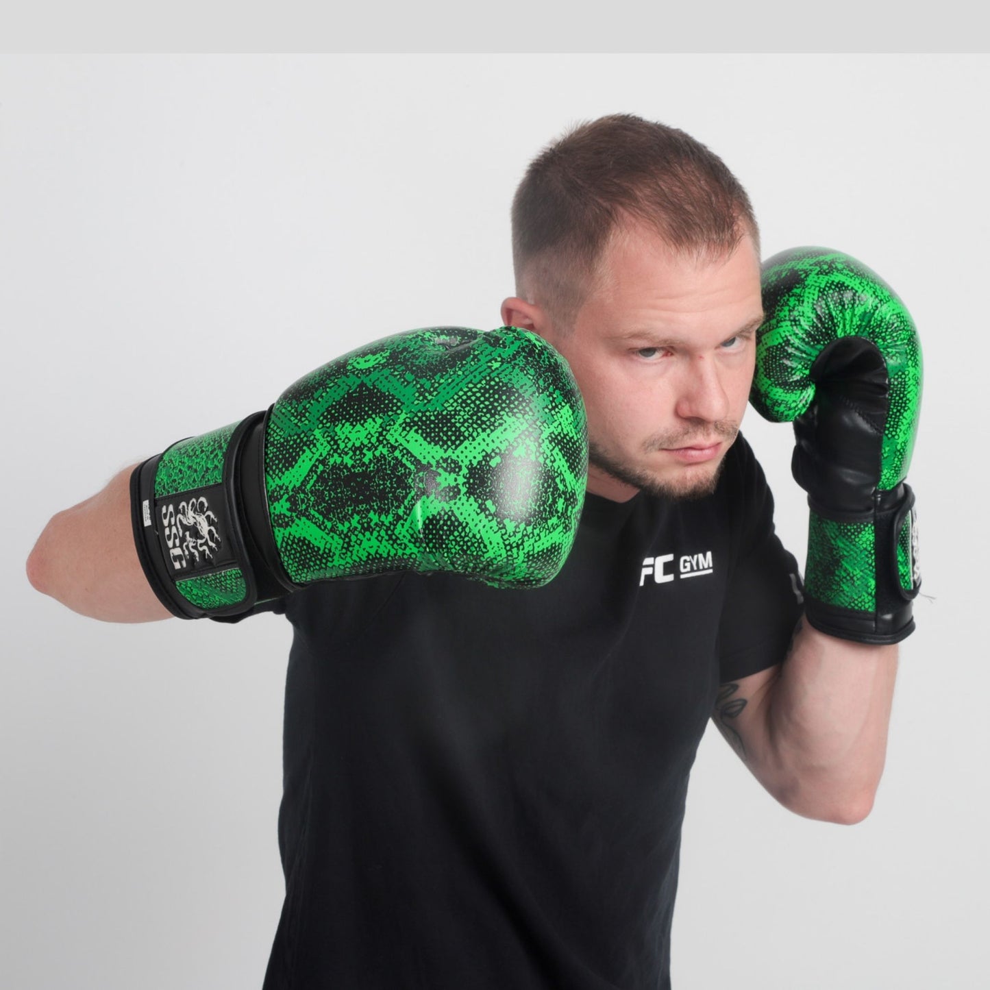 Viper Venom boxing gloves – sleek black and green training gloves with wrist support for sparring and bag work