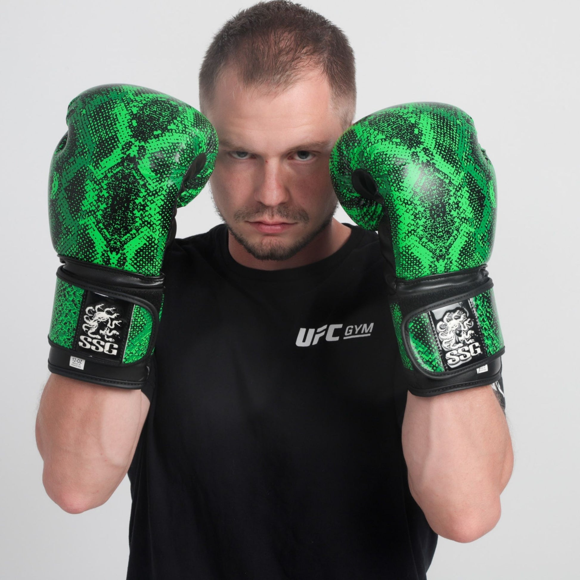 Viper Venom boxing gloves – sleek black and green training gloves with wrist support for sparring and bag work