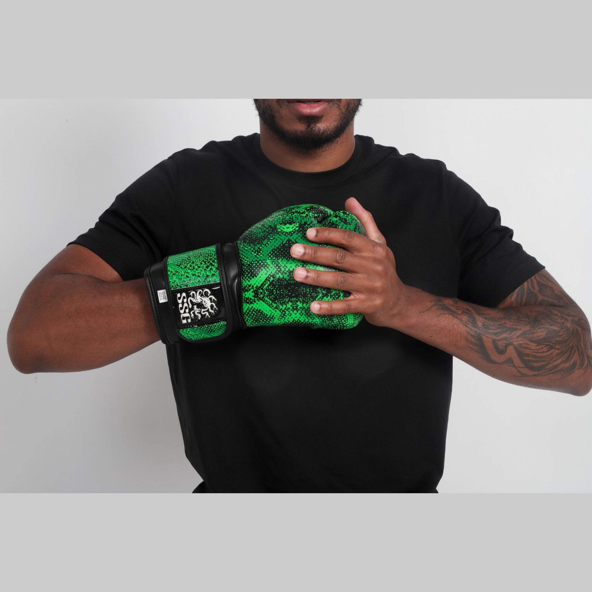 Viper Venom boxing gloves – sleek black and green training gloves with wrist support for sparring and bag work