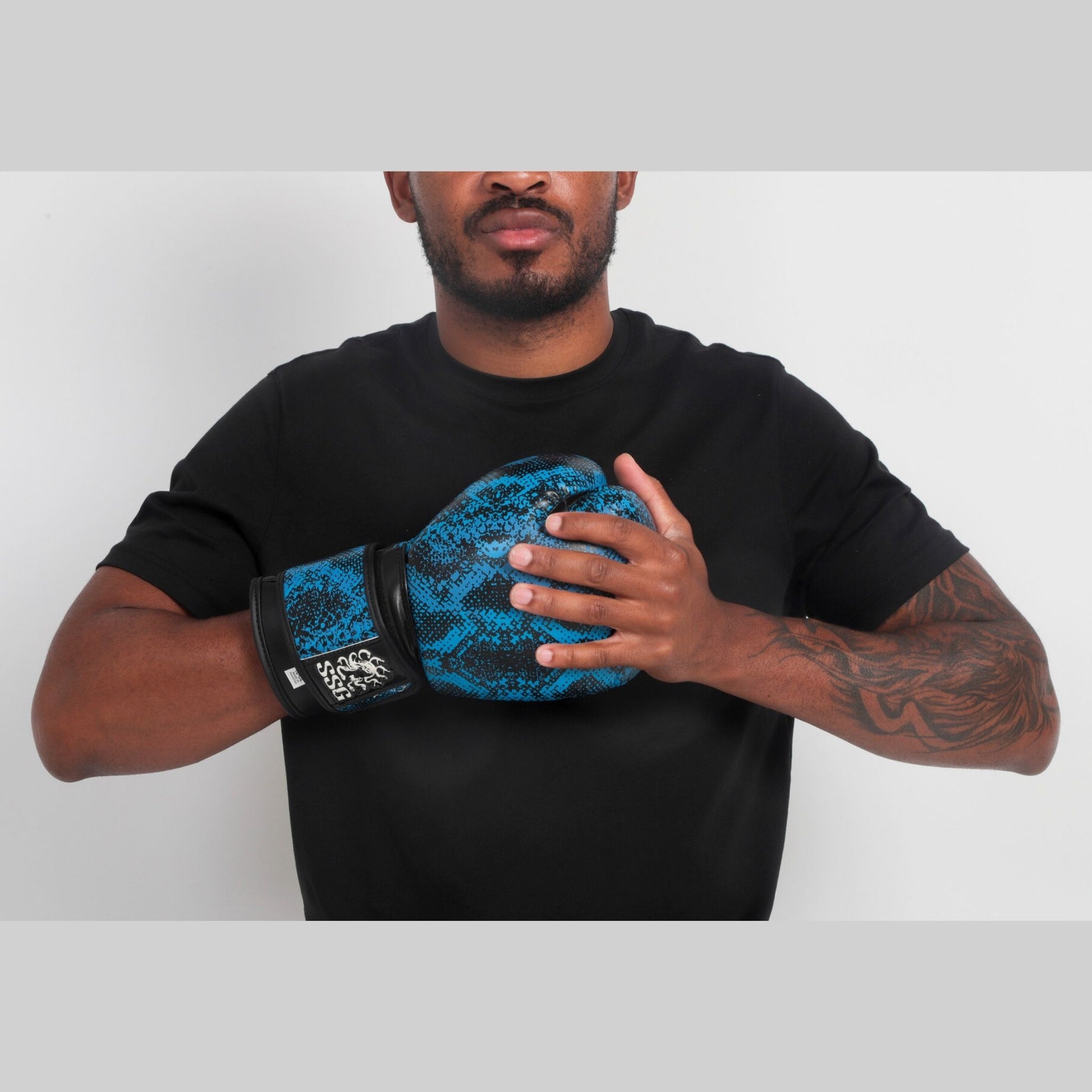 Athlete posing with Medusa’s Blue Gaze gloves – premium fit and modern style by StoneStrikeGear