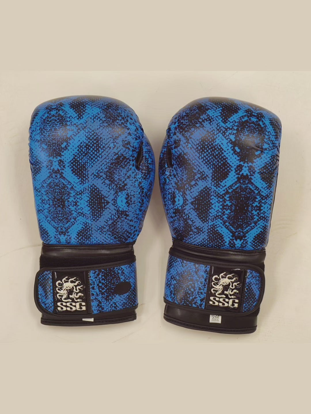 Product video showing close-up and angles of Medusa’s Blue Gaze boxing gloves